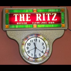 The Ritz Clock. Old clock from the 1950's with new advertising glass and rare neon spinner. 18 inches across.